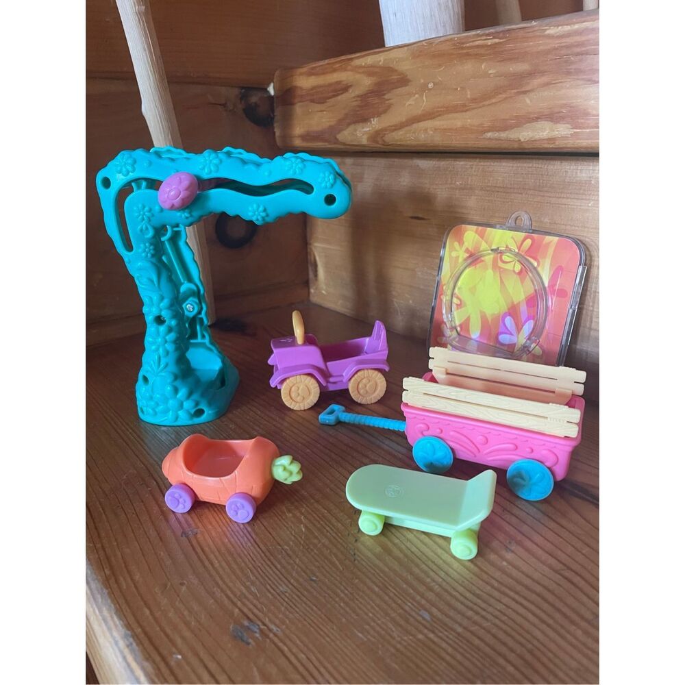 Vintage Littlest Pet Shop (LPS) toy vehicles and playground accessories released